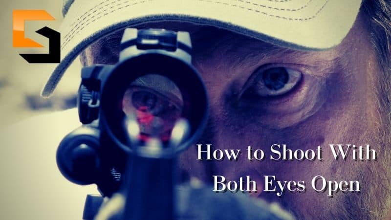 Chris aiming using a scope of a rifle.