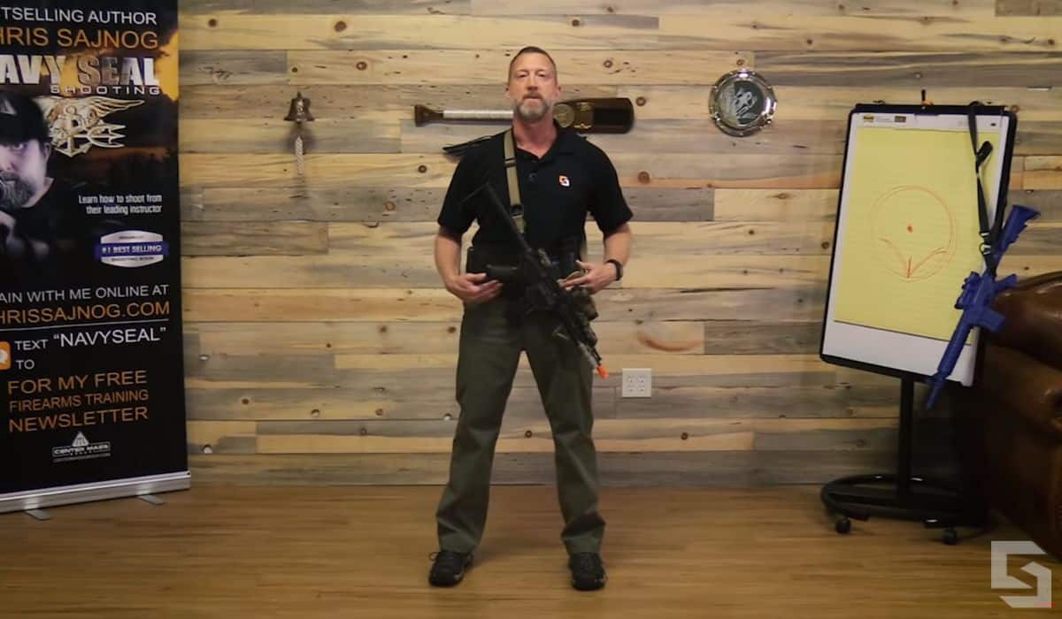 Chris Sajnog demonstrates the first step in shooting while standing.